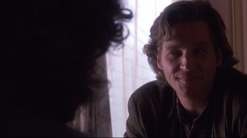 Movie still from “Fearless” (1993), directed by Peter Weir – A person sitting in front of a window; Close Up shot, Over the shoulder angle