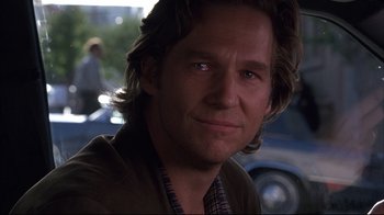 Movie still from “Fearless” (1993), directed by Peter Weir – A person with long hair; Close Up shot, Over the shoulder angle
