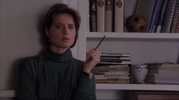 Movie still from “Fearless” (1993), directed by Peter Weir – A woman is holding a pen in her hand; Close Up shot, Low angle