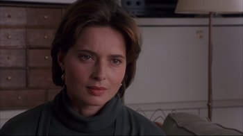 Movie still from “Fearless” (1993), directed by Peter Weir – A person wearing a green sweater; Close Up shot, Over the shoulder angle