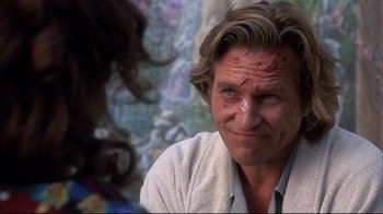 Movie still from “Fearless” (1993), directed by Peter Weir – A person wearing a white shirt; Close Up shot, Over the shoulder angle
