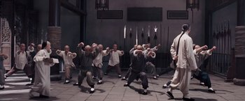 Movie still from “Fearless” (2006), directed by Ronny Yu – A group of people doing different kinds of martial arts; Wide shot, High angle