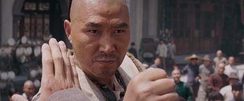 Movie still from “Fearless” (2006), directed by Ronny Yu – A person with a shaved head; Close Up shot, Low angle