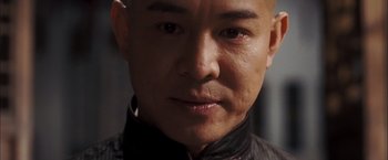Movie still from “Fearless” (2006), directed by Ronny Yu – A man's face in a black jacket; Close Up shot, Low angle