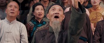 Movie still from “Fearless” (2006), directed by Ronny Yu – An old man with a long gray beard is looking up; Close Up shot, Low angle