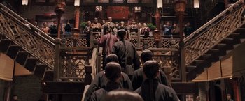 Movie still from “Fearless” (2006), directed by Ronny Yu – A group of people standing in front of an audience; Wide shot, Over the shoulder angle