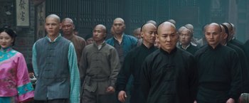Movie still from “Fearless” (2006), directed by Ronny Yu – A group of men standing next to each other; Medium shot, Over the shoulder angle