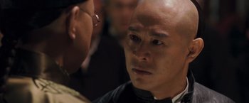 Movie still from “Fearless” (2006), directed by Ronny Yu – A person with a bald head; Close Up shot, Over the shoulder angle