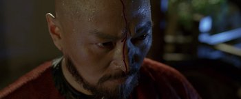 Movie still from “Fearless” (2006), directed by Ronny Yu – A person with a face paint on; Close Up shot, High angle