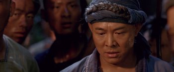 Movie still from “Fearless” (2006), directed by Ronny Yu – A man with a head scarf on looking at the camera; Close Up shot, High angle