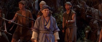 Movie still from “Fearless” (2006), directed by Ronny Yu – A group of men standing next to each other on top of a field; Medium shot, High angle