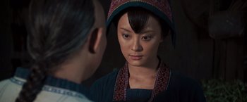 Movie still from “Fearless” (2006), directed by Ronny Yu – A woman in a hat looking at a man in a suit; Close Up shot, Over the shoulder angle