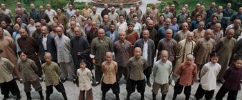 Movie still from “Fearless” (2006), directed by Ronny Yu – A large group of men standing in front of each other; Wide shot, High angle