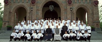 Movie still from “Fearless” (2006), directed by Ronny Yu – A large group of people in white shirts and black ties; Wide shot, High angle