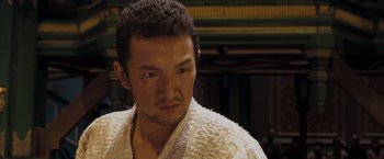 Movie still from “Fearless” (2006), directed by Ronny Yu – A person wearing a robe; Close Up shot, Low angle