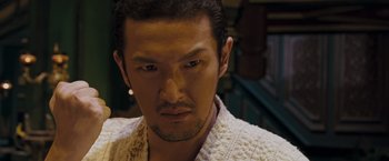Movie still from “Fearless” (2006), directed by Ronny Yu – A person wearing a robe; Close Up shot, Low angle