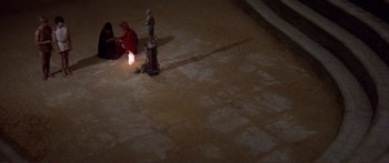 Movie still from “Fellini Satyricon” (1969), directed by Federico Fellini – A fire hydrant lit up by a candle on the floor; Extreme Wide shot, Overhead angle