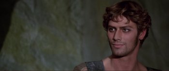 Movie still from “Fellini Satyricon” (1969), directed by Federico Fellini – A person with a beard; Close Up shot, Over the shoulder angle