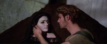 Movie still from “Fellini Satyricon” (1969), directed by Federico Fellini – A man and a woman dressed as a witch and a vampire; Close Up shot, Over the shoulder angle
