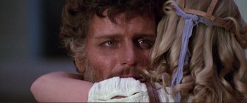 Movie still from “Fellini Satyricon” (1969), directed by Federico Fellini – A man's face and a woman's hair; Close Up shot, Over the shoulder angle