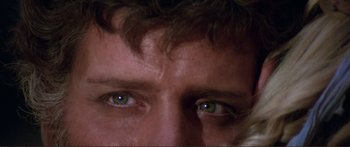 Movie still from “Fellini Satyricon” (1969), directed by Federico Fellini – A man's eyes with green eyes; Extreme Close Up shot, Over the shoulder angle