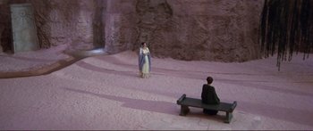Movie still from “Fellini Satyricon” (1969), directed by Federico Fellini – A man and a woman are standing in the desert; Extreme Wide shot, High angle