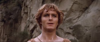 Movie still from “Fellini Satyricon” (1969), directed by Federico Fellini – A person with long blonde hair; Close Up shot, Low angle