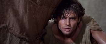 Movie still from “Fellini Satyricon” (1969), directed by Federico Fellini – A person with his eyes closed; Close Up shot, Low angle