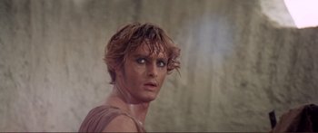 Movie still from “Fellini Satyricon” (1969), directed by Federico Fellini – A person with wet hair; Close Up shot, Over the shoulder angle