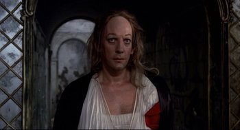 Movie still from “Fellini's Casanova” (1976), directed by Federico Fellini – A woman with a red bandage on her face; Close Up shot, Low angle