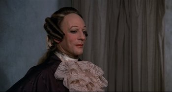 Movie still from “Fellini's Casanova” (1976), directed by Federico Fellini – A woman in a victorian dress with long hair; Close Up shot, Over the shoulder angle