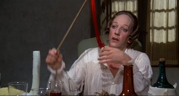 Movie still from “Fellini's Casanova” (1976), directed by Federico Fellini – A woman is holding a stick in her hand; Close Up shot, High angle