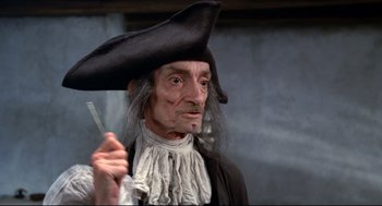 Movie still from “Fellini's Casanova” (1976), directed by Federico Fellini – An old man dressed as a pirate holding a sword; Close Up shot, Low angle