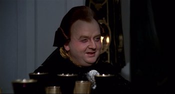 Movie still from “Fellini's Casanova” (1976), directed by Federico Fellini – A person wearing a costume; Close Up shot, High angle