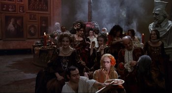 Movie still from “Fellini's Casanova” (1976), directed by Federico Fellini – A group of people dressed up as witches and vampires; Wide shot, High angle