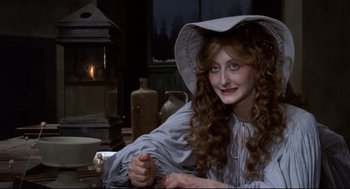 Movie still from “Fellini's Casanova” (1976), directed by Federico Fellini – A woman with long hair wearing a white hat; Medium shot, High angle