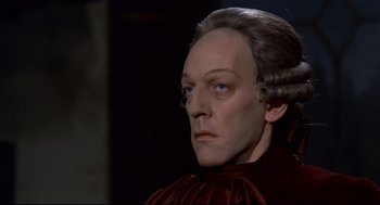 Movie still from “Fellini's Casanova” (1976), directed by Federico Fellini – A person wearing a wig; Close Up shot, High angle