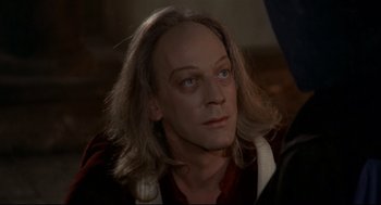 Movie still from “Fellini's Casanova” (1976), directed by Federico Fellini – A person with long blonde hair; Close Up shot, Over the shoulder angle