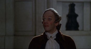 Movie still from “Fellini's Casanova” (1976), directed by Federico Fellini – A man in a wig and a brown jacket; Close Up shot, High angle