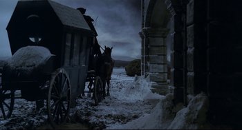 Movie still from “Fellini's Casanova” (1976), directed by Federico Fellini – A horse drawn carriage in the middle of a snow covered road; Wide shot, Low angle