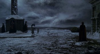 Movie still from “Fellini's Casanova” (1976), directed by Federico Fellini – A person standing on top of a snow covered field; Extreme Wide shot, High angle