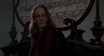 Movie still from “Fellini's Casanova” (1976), directed by Federico Fellini – A man with long blonde hair wearing a brown jacket; Medium shot, Low angle