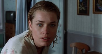 Movie still from “Femme Fatale” (2002), directed by Brian De Palma – A person with wet hair; Close Up shot, Over the shoulder angle