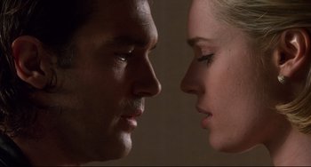 Movie still from “Femme Fatale” (2002), directed by Brian De Palma – A man and a woman face to face; Extreme Close Up shot, Low angle