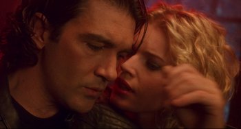 Movie still from “Femme Fatale” (2002), directed by Brian De Palma – A man and a woman face to face with their eyes closed; Close Up shot, Low angle