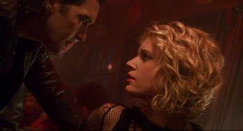 Movie still from “Femme Fatale” (2002), directed by Brian De Palma – A man and a woman are looking at one another; Close Up shot, Low angle