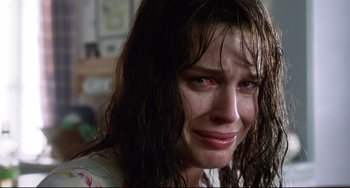 Movie still from “Femme Fatale” (2002), directed by Brian De Palma – A woman with wet hair crying in a room; Close Up shot, Low angle