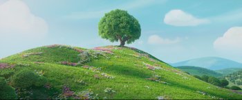 Movie still from “Ferdinand” (2017), directed by Carlos Saldanha – A tree on top of a grassy hill with flowers around it; Extreme Wide shot, High angle