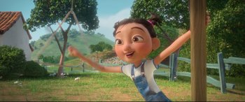 Movie still from “Ferdinand” (2017), directed by Carlos Saldanha – A girl is standing in the grass with her arms in the air; Medium shot, Low angle