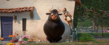 Movie still from “Ferdinand” (2017), directed by Carlos Saldanha – A large black bull standing next to a person; Wide shot, Low angle